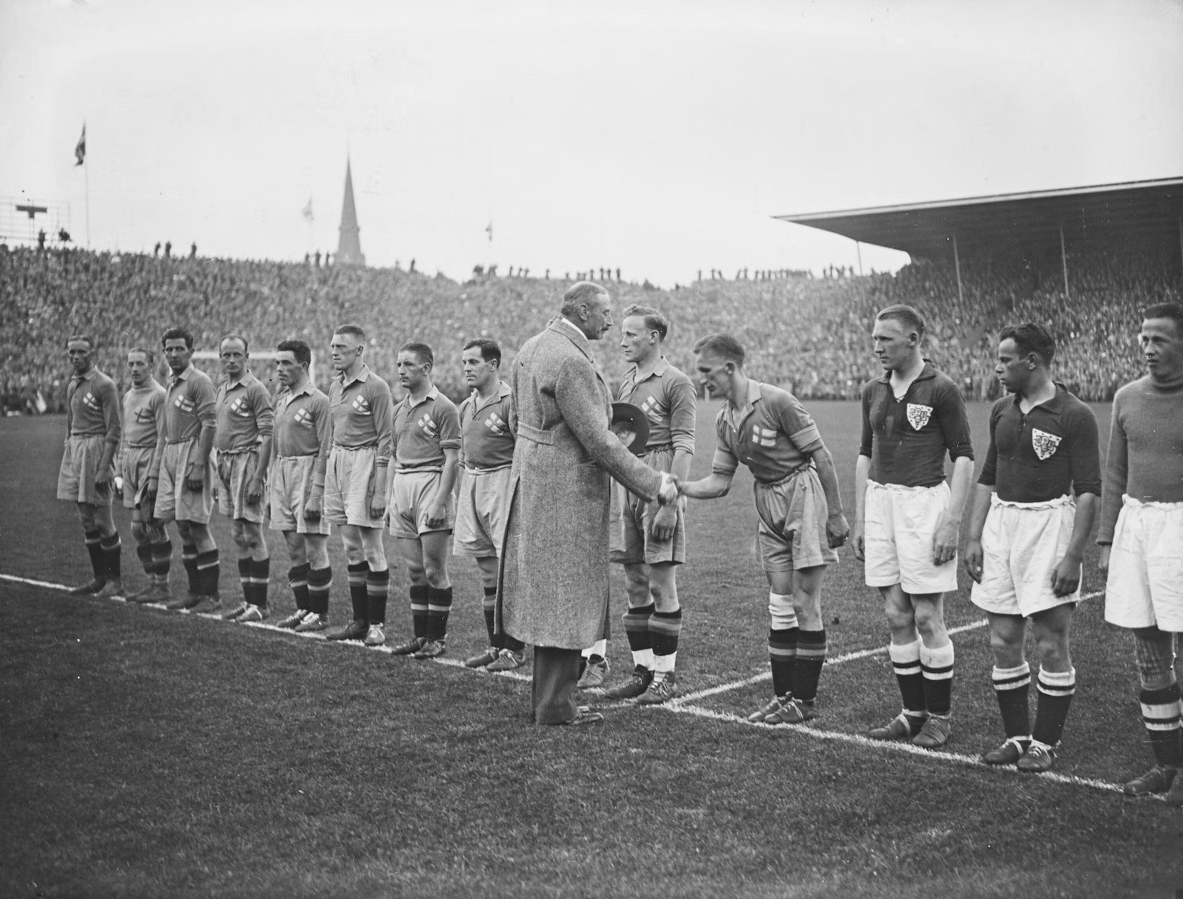 Vintage soccer match, pre-game handshake